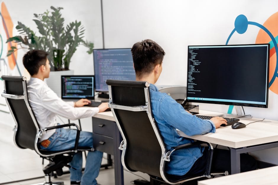 developers coding on computers developers coding on computers
